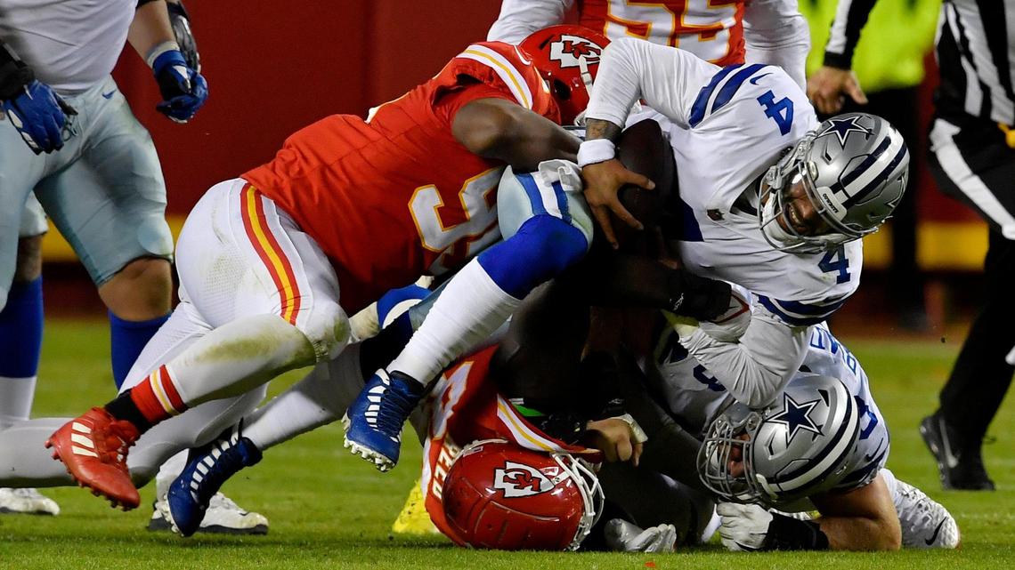 Kansas City Chiefs defensive tackle Chris Jones, left, sacks quarterback Dak Prescott during the fourth quarter of the Dallas Cowboys’ 19-9 loss Sunday evening.