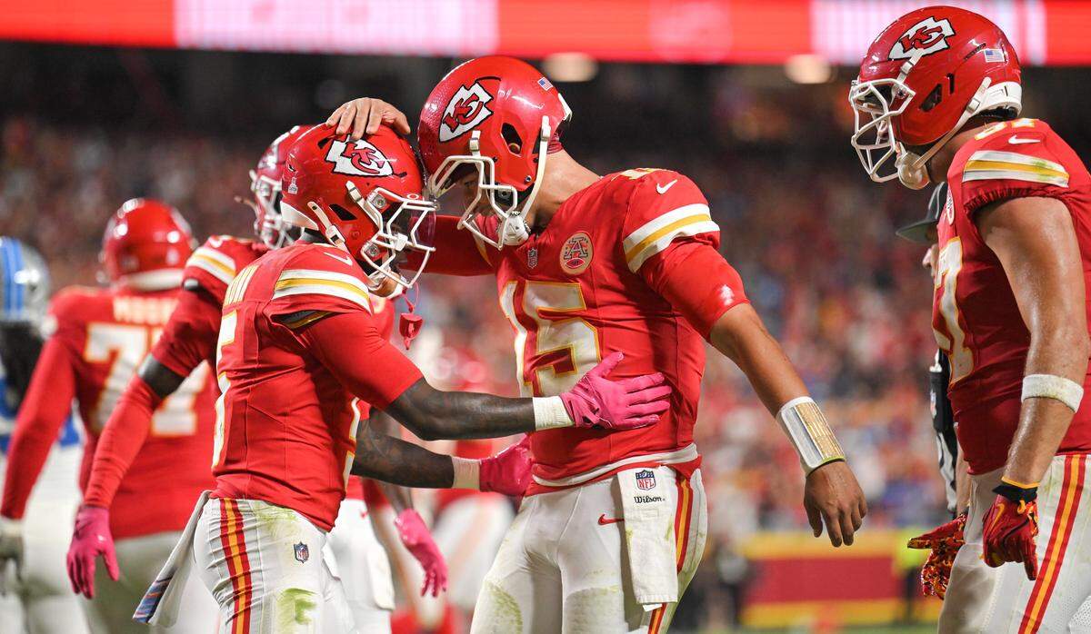 Kansas City Chiefs quarterback Patrick Mahomes (15) congratulates Kansas City Chiefs wide receiver Hollywood Brown (5) after Brown ran in for a touchdown in the third quarter against the Detroit Lions on Sunday, Oct. 12, 2025, at GEHA Field at Arrowhead Stadium.