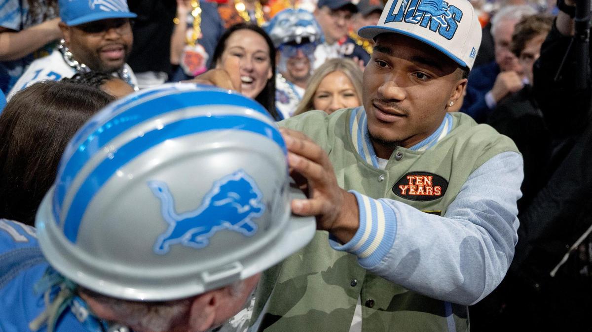 Alabama defensive back Brian Branch autographs a Detroit Lions fan’s hard hat after being picked 45th overall by Detroit during the second round of the NFL Draft outside of Union Station on Friday, April 28, 2023, in Kansas City.