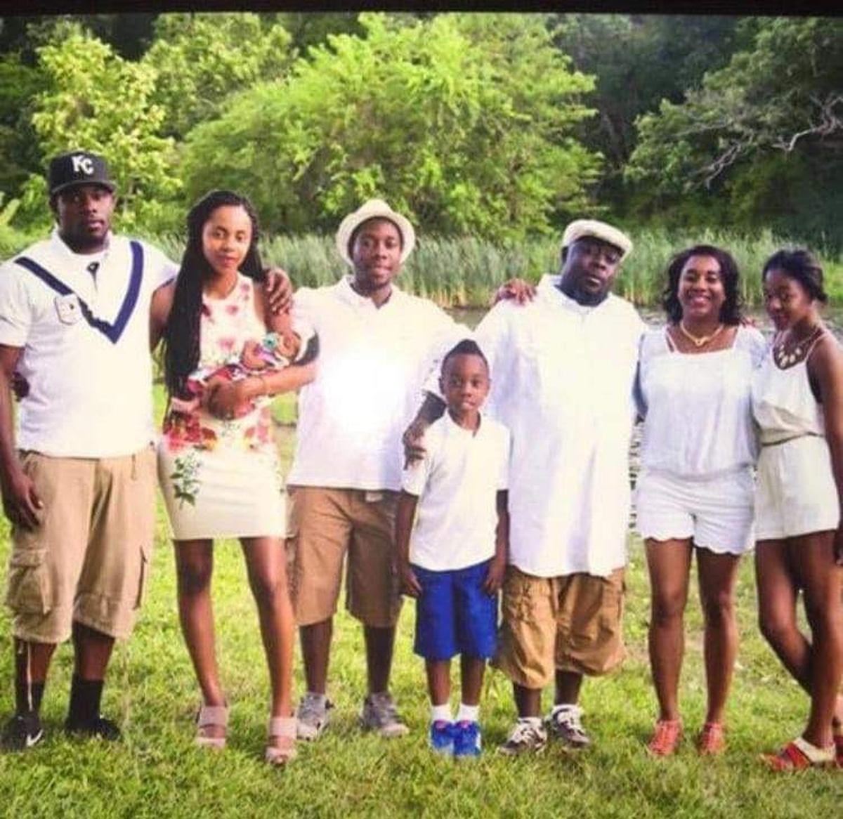 In this family photo, Diamond Fuse holds her daughter Bella Watson and is joined by brothers Cortez Christopher, James Christopher IV and Justice Christopher, along with stepfather James Christopher III, mother Cecillia Green and younger sister Sonia Pryce.