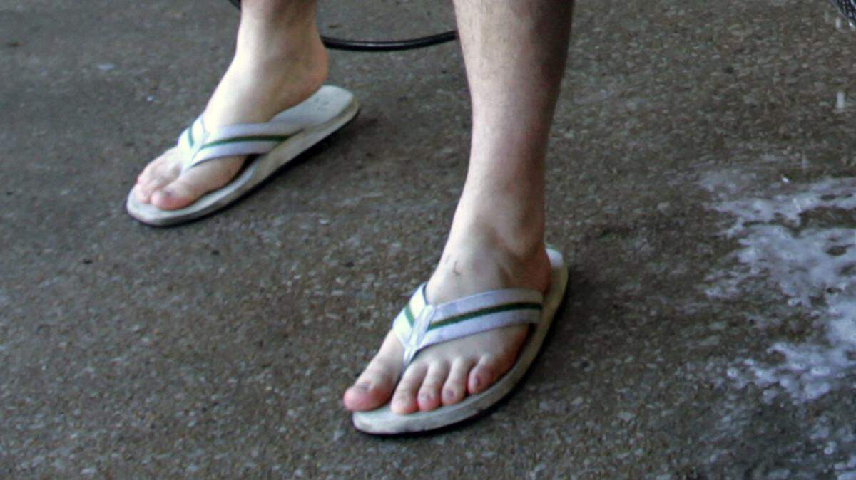 They wear two shirts, a sub-zero hoodie and a stocking cap, but leave their legs and feet bare.