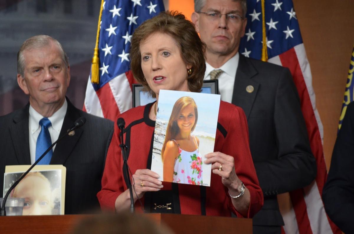 Rep. Vicki Hartler speaks at a June press conference holding a photo of Samantha Huntley, 20, a Springfield woman who died of a heroin overdose.