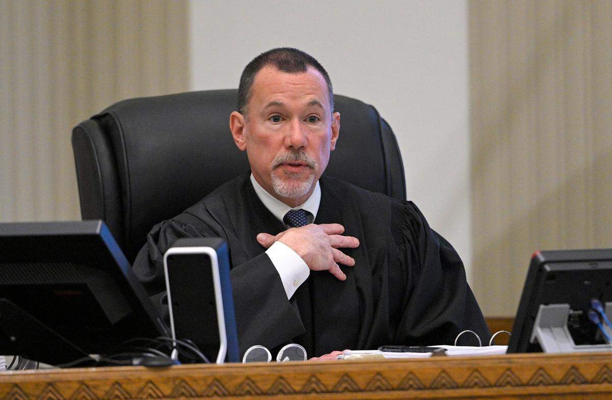 Jackson County Circuit Court Judge J. Dale Youngs explains a visit he and others made the previous day to the scene of the shooting in the fourth day of the trial of Kansas City police detective Eric DeValkenaere, in Jackson County Circuit Court Friday, Nov. 12, 2021. DeValkenaere faces charges of first-degree involuntary manslaughter and armed criminal action in the Dec. 3, 2019, shooting of Cameron Lamb.