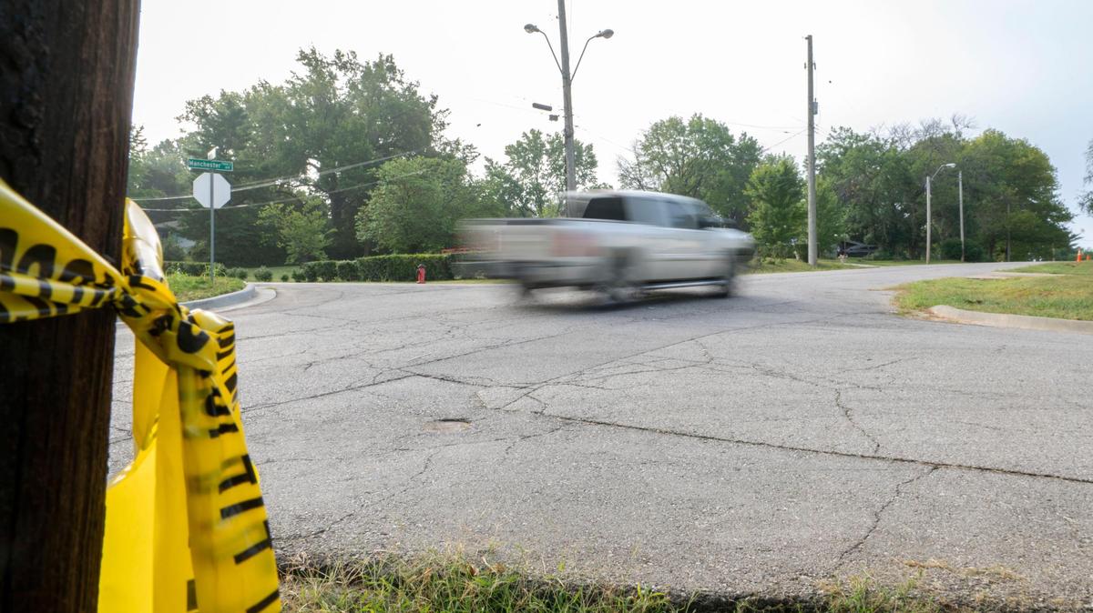 Caution tape remains tied to a post on Tuesday, Sep. 6, 2022, from a shooting that occurred Monday night near Manchester Ave. and East 73rd St. in Kansas City.