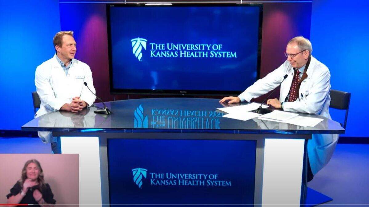 Dana Hawkinson, left, and Steve Sites of The University of Kansas Health System in a January 2022 news briefing.