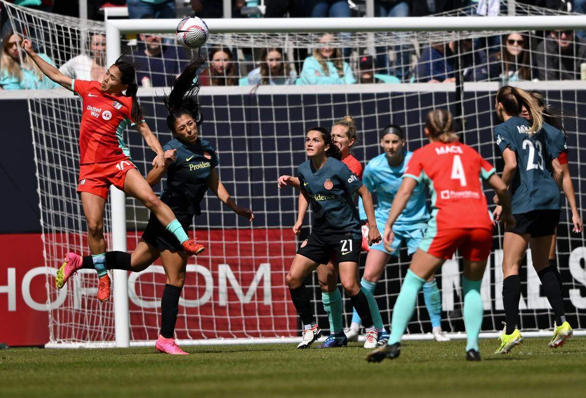 Kansas Current midfielder Lo’eau LaBonta (10) goes for a header during the home opener against the Portland Thorns at CPKC Stadium on Saturday, March 16, 2024, in Kansas City.