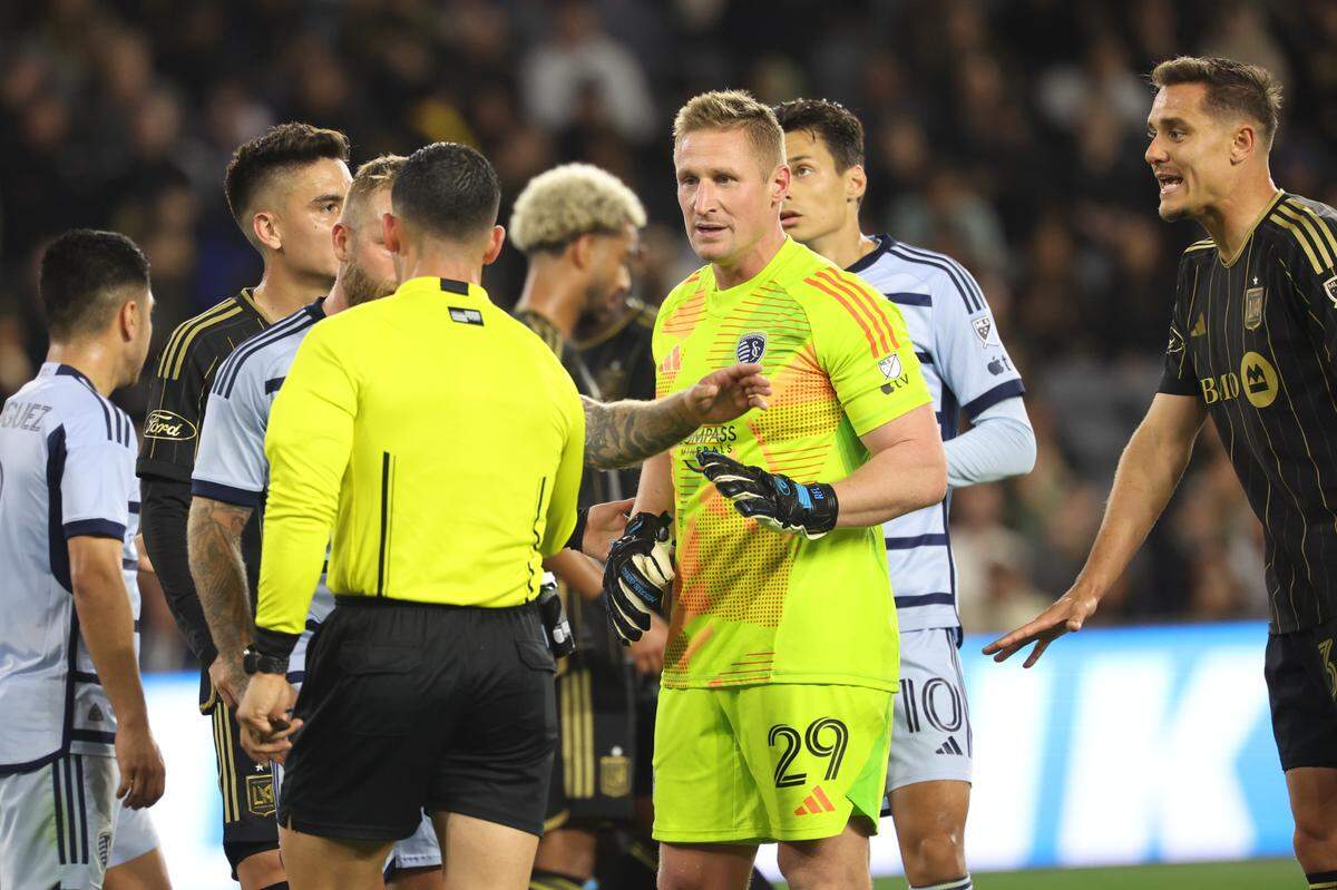 Sporting Kansas City goalkeeper Tim Melia (29) reacts in a scrum of players during the second half against LAFC at BMO Stadium on March 9, 2024.