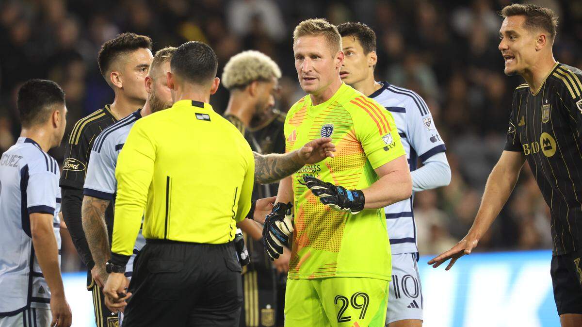 Sporting Kansas City goalkeeper Tim Melia (29) reacts in a scrum of players during the second half against LAFC at BMO Stadium on March 9, 2024.