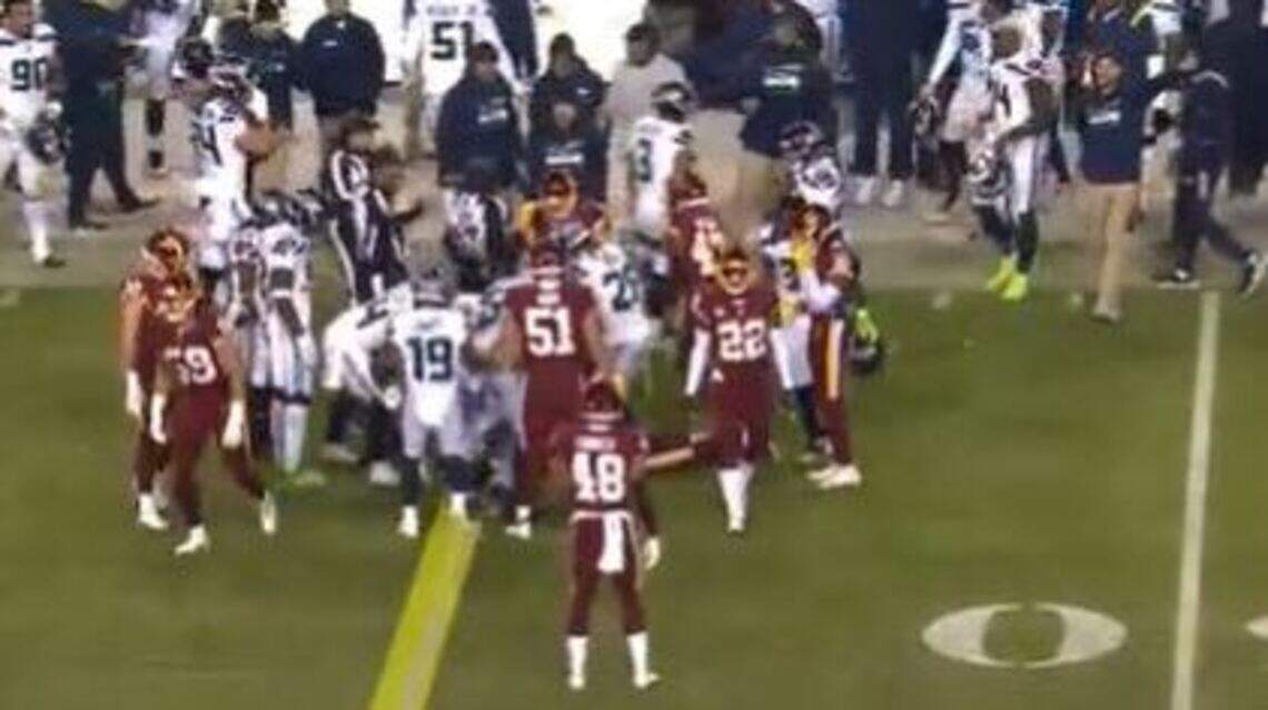 The explanation for why Seattle was penalized on onside-kick recovery at Washington