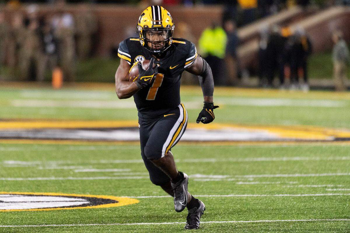 Missouri running back Tyler Badie runs the ball during the fourth quarter of an NCAA college football game against South Carolina Saturday, Nov. 13, 2021, in Columbia, Mo. Missouri won 31-28. (AP Photo/L.G. Patterson)