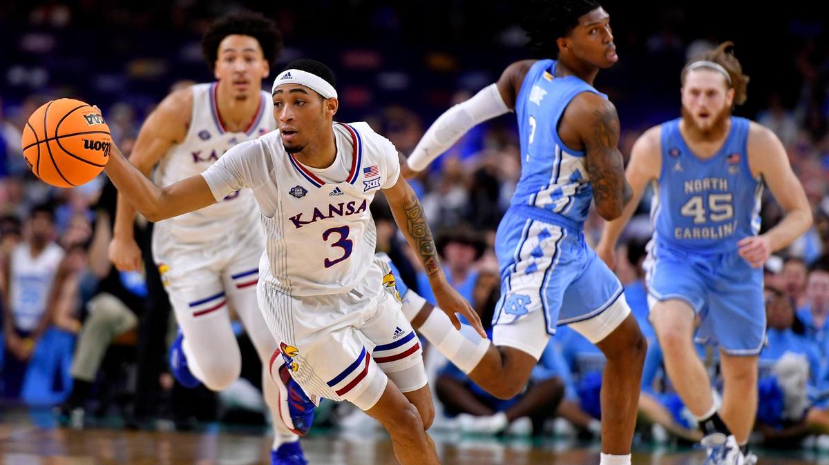 KU’s Dajuan Harris stole the ball from UNC’s Caleb Love during the second half of Monday night’s NCAA championship game at the Superdome in New Orleans. KU beat North Carolina, 72-69.