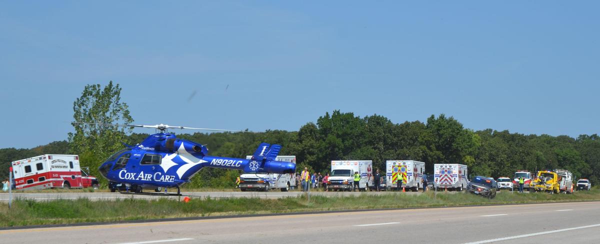 Emergency responders worked the scene of a church bus crash near Bolivar, Mo. Three Kansas City-area teens were killed.