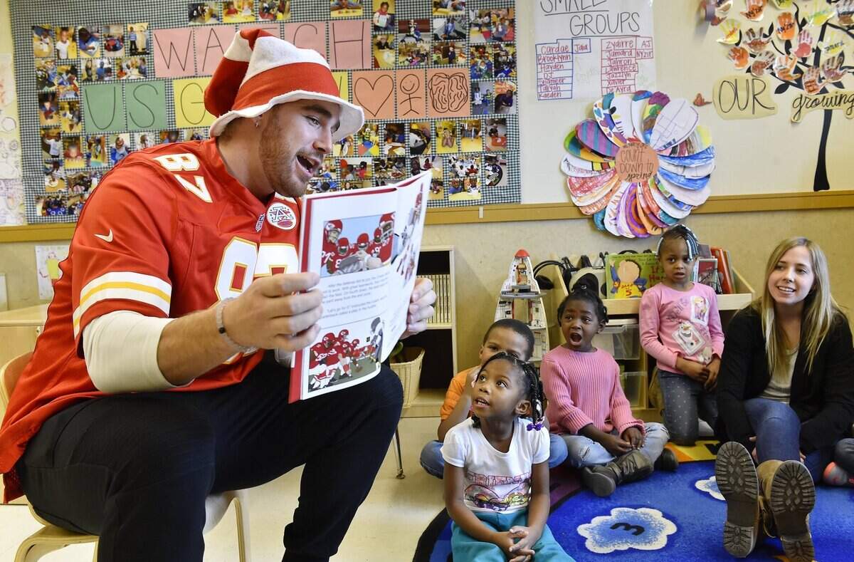 Kansas City Chiefs tight end Travis Kelce read “Let’s Go, Chiefs!” to Operation Breakthrough pre-kindergarten students as part of Read Across America Day Monday, Mar. 2, 2015.  The kids were permitted to shout whenever the words “let’s go, Chiefs!” appeared in the story.  After, a dance party broke out when it was revealed Kelce likes to dance.