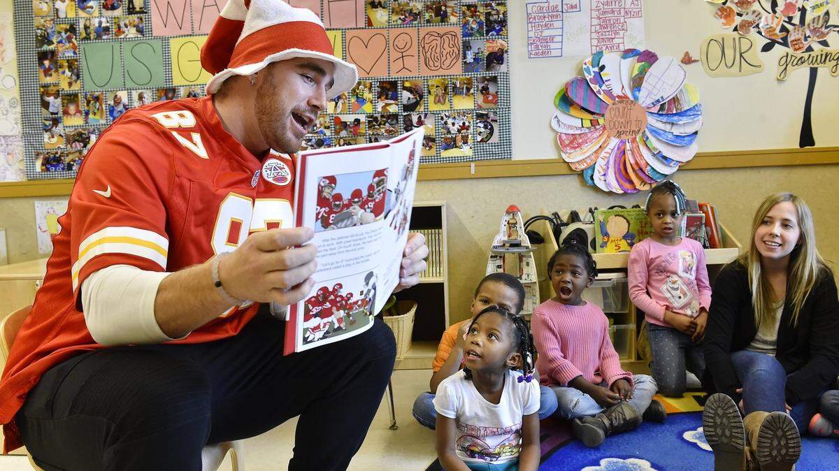 Kansas City Chiefs tight end Travis Kelce read “Let’s Go, Chiefs!” to Operation Breakthrough pre-kindergarten students as part of Read Across America Day Monday, Mar. 2, 2015.  The kids were permitted to shout whenever the words “let’s go, Chiefs!” appeared in the story.  After, a dance party broke out when it was revealed Kelce likes to dance.
