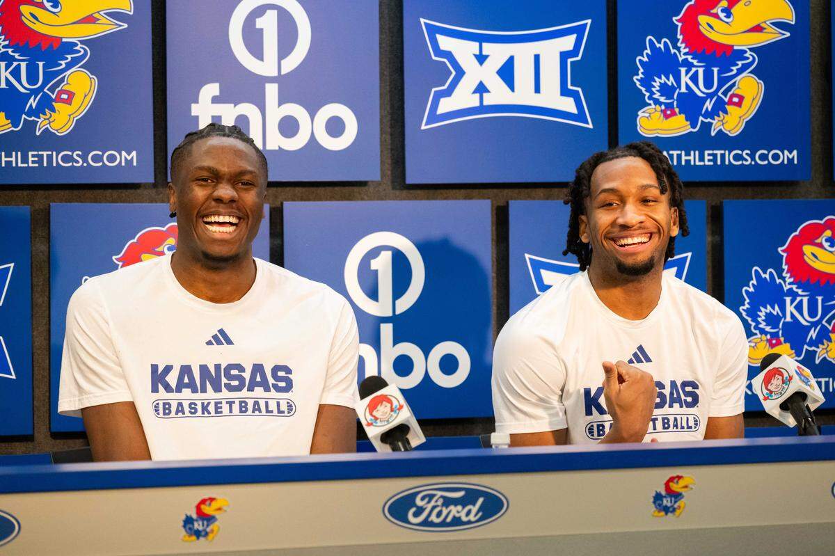 Kansas Jayhawks guard Darryn Peterson and forward Flory Bidunga share a laugh during the press conference following the Jayhawks game vs. the Baylor Bears on Friday, January 16, 2026, at Allen Fieldhouse.