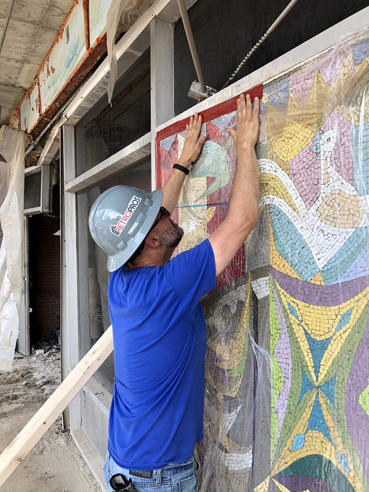 The mosaic is prepared for removal from the soon-to-be-demolished Board of Education Building in 2020.