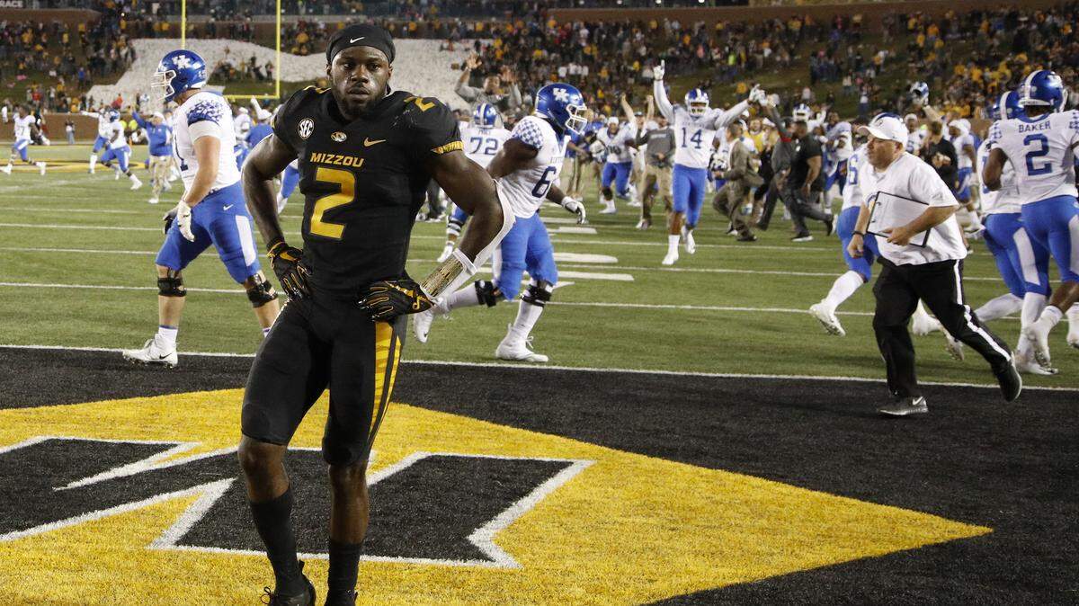 Missouri defensive back DeMarkus Acy stood in the end zone while Kentucky players celebrated after Kentucky scored the winning touchdown on Saturday in Columbia.