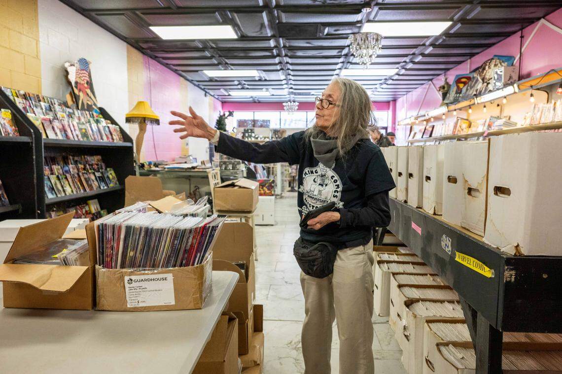 Sharon Farris, owner of Clint's Comics, in Independence on Tuesday, January 7, 2026. Clint's Comics was previously located in Midtown Kansas City before the ceiling collapsed on the building it occupied. Farris says she's is still in the process of unboxing items, but is excited to have people back in her shop.