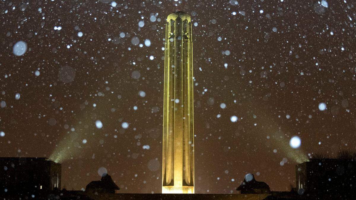 Snow falls on the Liberty Memorial Tower on Monday, Nov. 14, 2022 in Kansas City.