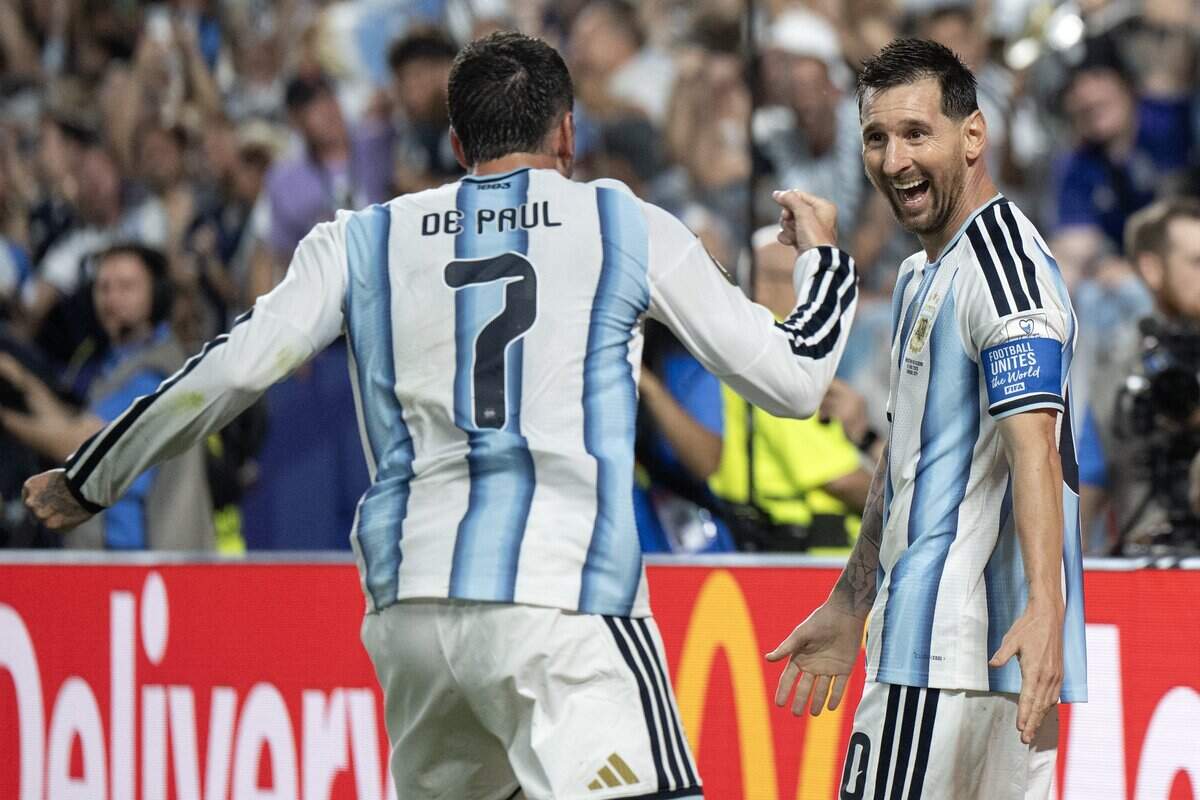 Argentina forward Lionel Messi (10) celebrates with teammate midfielder Rodrigo de Paul (7) after scoring his third goal in the second half of a FIFA World Cup group-stage soccer match against Algeria at Kansas City (Arrowhead) Stadium on Tuesday, June 16, 2026, in Kansas City.