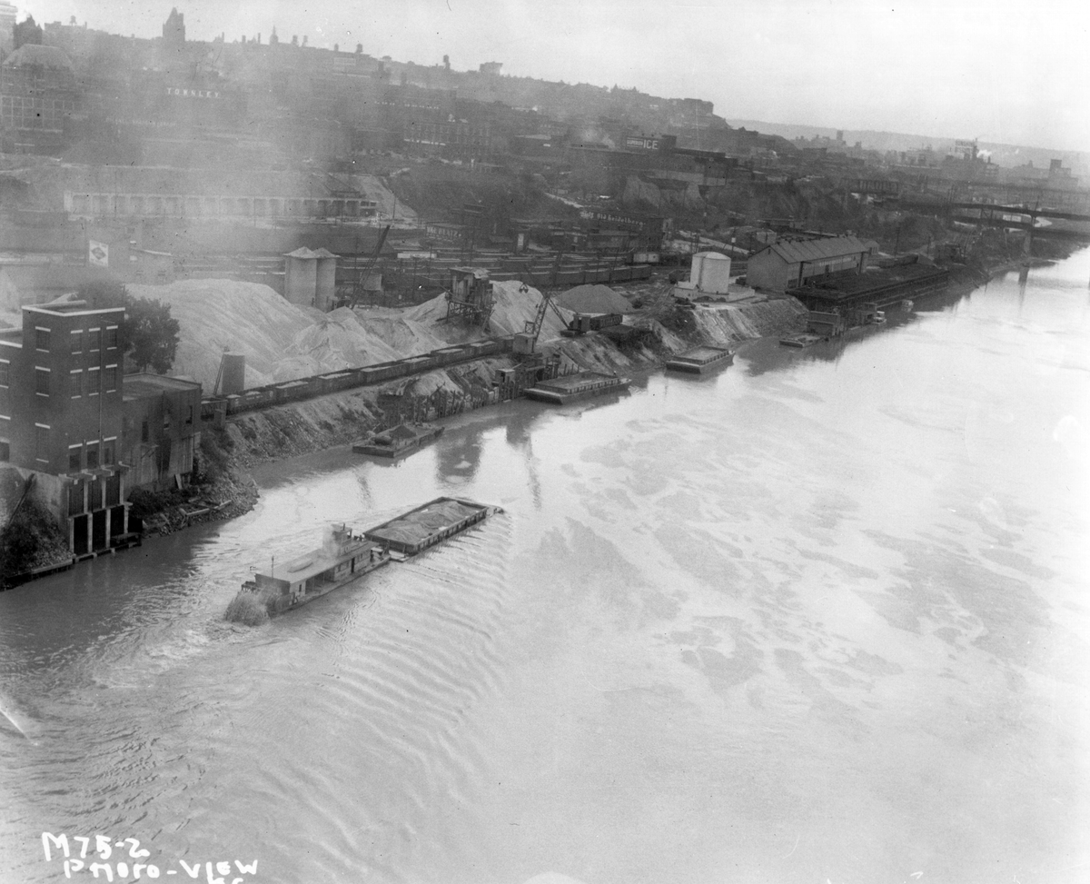 Riverfront area showing sand dredging operations, 1930.