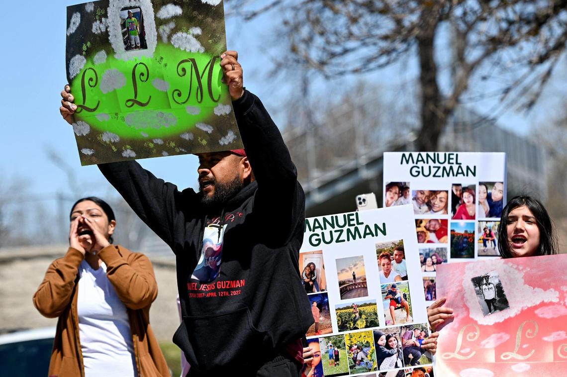 Manuel Guzman’s uncle Juan Guzman questioned security at Northeast Middle School as he shouted at officials on Monday. The “LLM” on his sign stands for “Long Live Manny.”