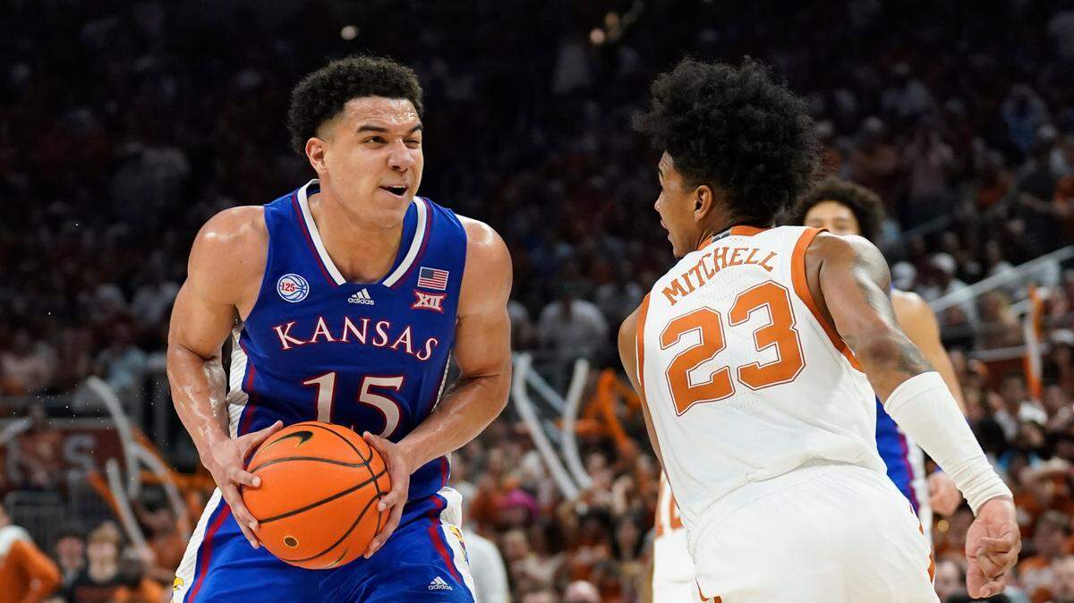Kansas Jayhawks guard Kevin McCullar Jr. (15) drives to the basket against Texas Longhorns forward Dillon Mitchell (23) during the second half at Moody Center on March 4, 2023.