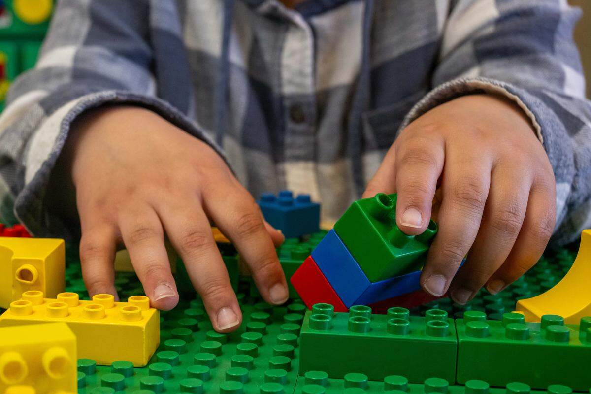 Oakley Harris plays with building blocks on Wednesday, March 11, 2026, in Bonner Springs. Oakley, a student in Bonner Springs-Edwardsville Unified School District, has received special education services since she was a toddler.