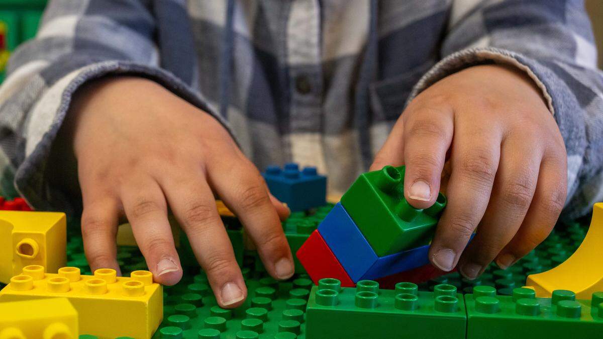 Oakley Harris plays with building blocks on Wednesday, March 11, 2026, in Bonner Springs. Oakley, a student in Bonner Springs-Edwardsville Unified School District, has received special education services since she was a toddler.
