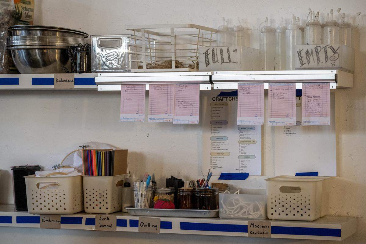 Order tickets hang beneath shelves of craft supplies at ADHDIY Craft Cafe on Saturday, Feb. 7, 2026, in Kansas City.