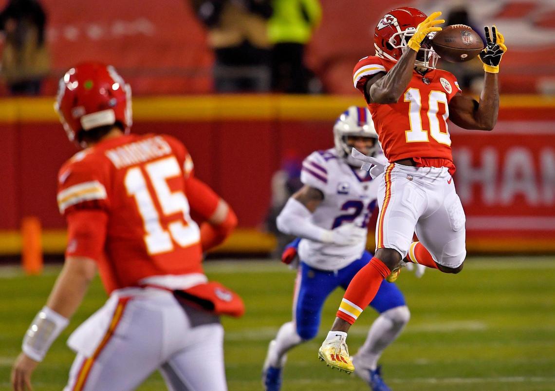 Chiefs wide receiver Tyreek Hill catches a pass from quarterback Patrick Mahomes during the first half of the AFC Championship Game Sunday at Arrowhead Stadium. Kansas City beat Buffalo, 38-24.