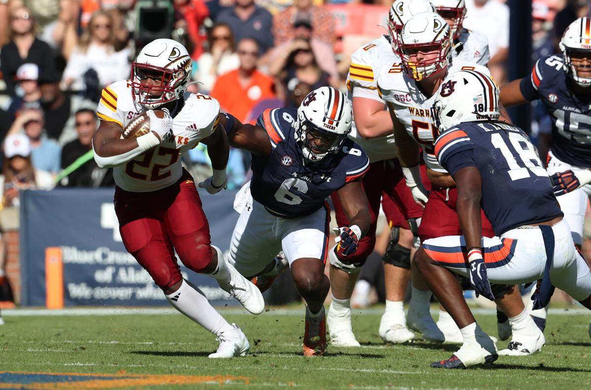 Louisiana Monroe Warhawks running back Ahmad Hardy (22) avoids the tackle of Auburn Tigers linebacker Austin Keys (6) during the second quarter at Jordan-Hare Stadium on Nov. 16, 2024.