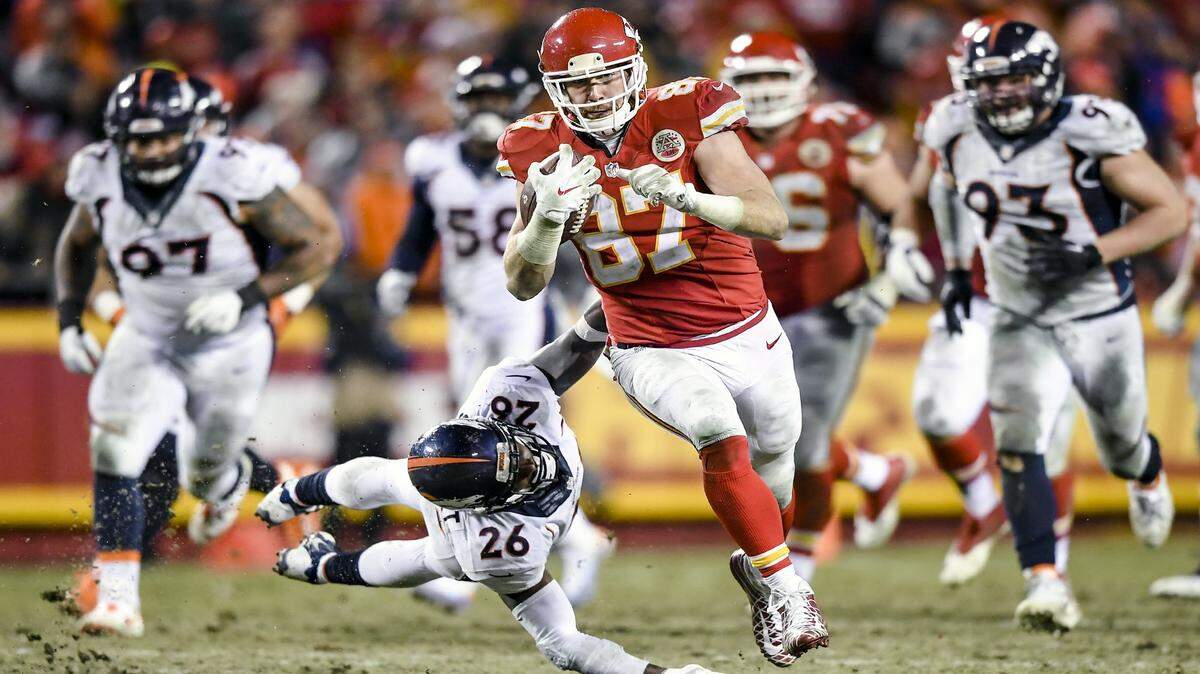 Kansas City Chiefs tight end Travis Kelce (87) eluded Denver Broncos free safety Darian Stewart (26) on Sunday during the third quarter in the NFL football game at Arrowhead Stadium in Kansas City.