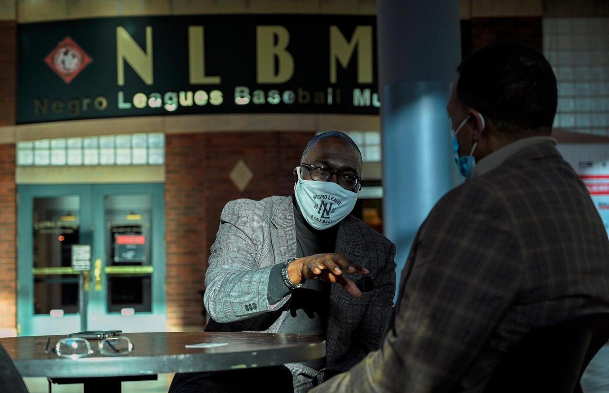 Bob Kendrick, left, president of the Negro Leagues Baseball Museum, discusses the future Buck O’Neil education and research center that will be built in the former Paseo YMCA building.