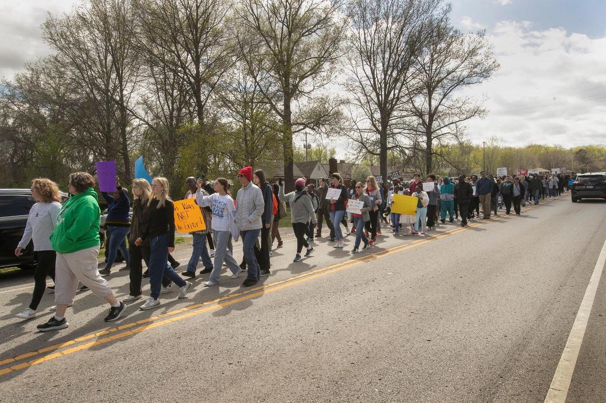 Rally participants marched and chanted as they went to a Northland house where a 16-year-old high school student was shot.
