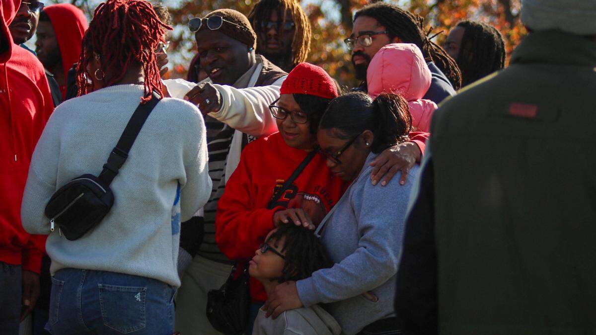 Cecelia Wilson, 62, shares a hug with a family member at a balloon release for her son Kenneth R. Williams jr., 32. Williams was shot and killed by a Raytown police officer at a QuikTrip after allegedly making a threat about having weapons and explosives in his car.