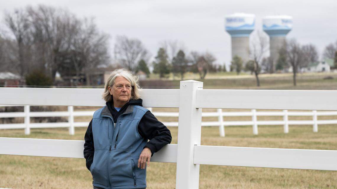 Carol Peterson stands along her property fence line for a portrait on Saturday, March 7, 2026, in Spring Hill, Kansas.