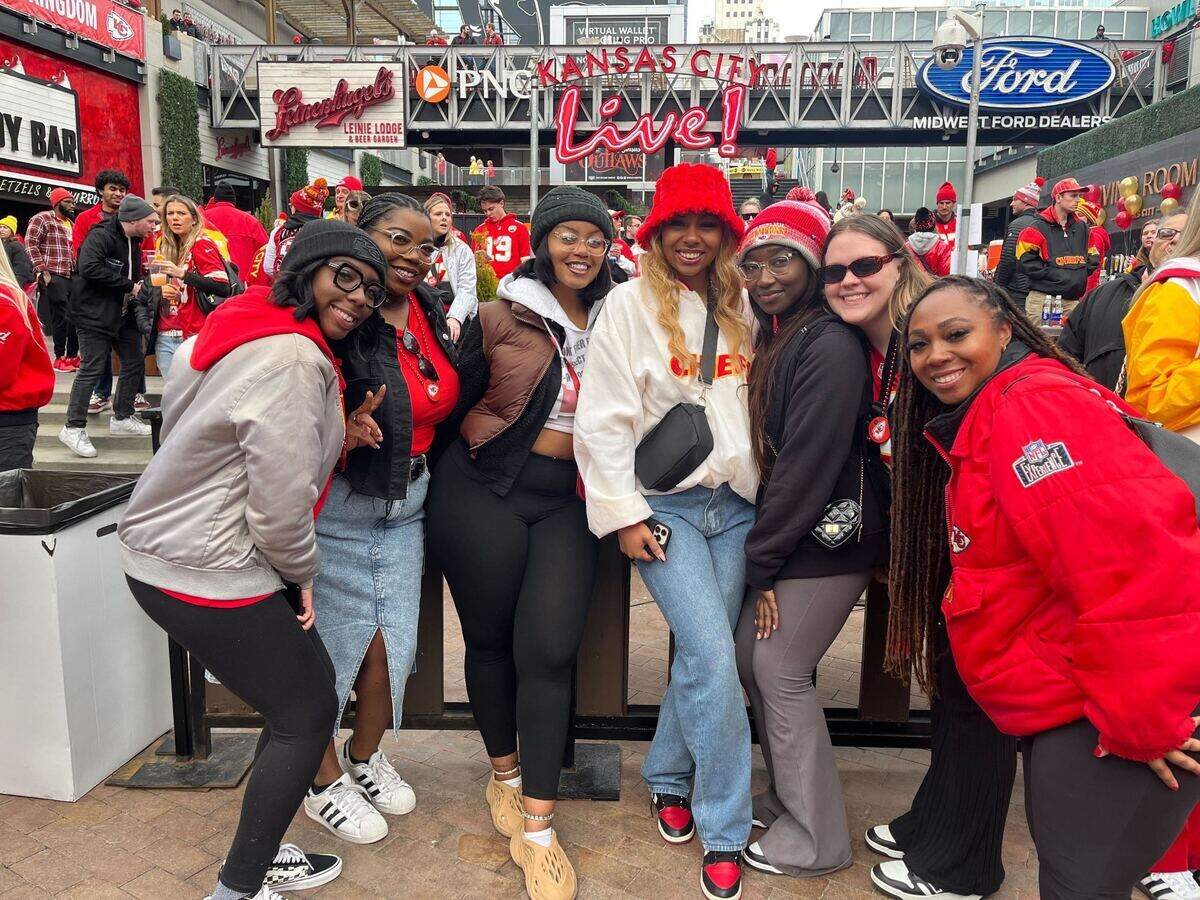 Gabby Simms, 27, at right, and her friends donned red and yellow and arrived at Kansas City’s Power & Light District around noon to enjoy the Super Bowl Watch party.