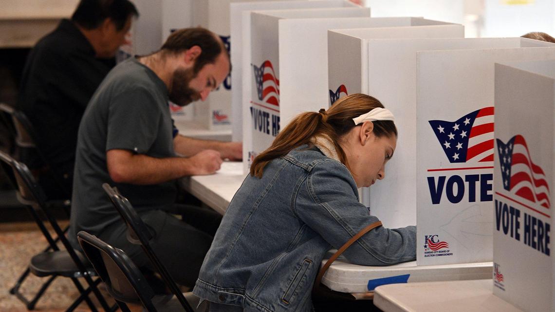 Voters fill out their ballots while voting Tuesday afternoon at St. Andrew’s Episcopal Church in Brookside.
