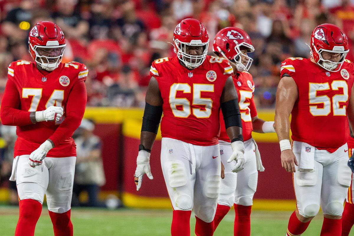 Members of the Kansas City Chiefs offensive line prepare to line up for a play in the first quarter of the Chiefs preseason game vs. the Chicago Bears at GEHA Field at Arrowhead Stadium on Friday, Aug. 22, 2025, in Kansas City.