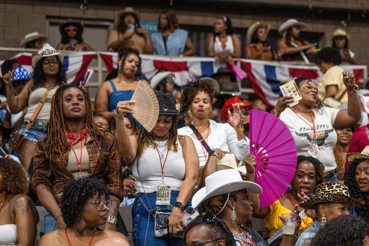 Rodeo fans with fans packed the stands and danced at the Black Rodeo USA show at Hale Arena in Kansas City on Saturday. The rodeo held two sold out shows, showcasing rodeo skills from all BIPOC riders.