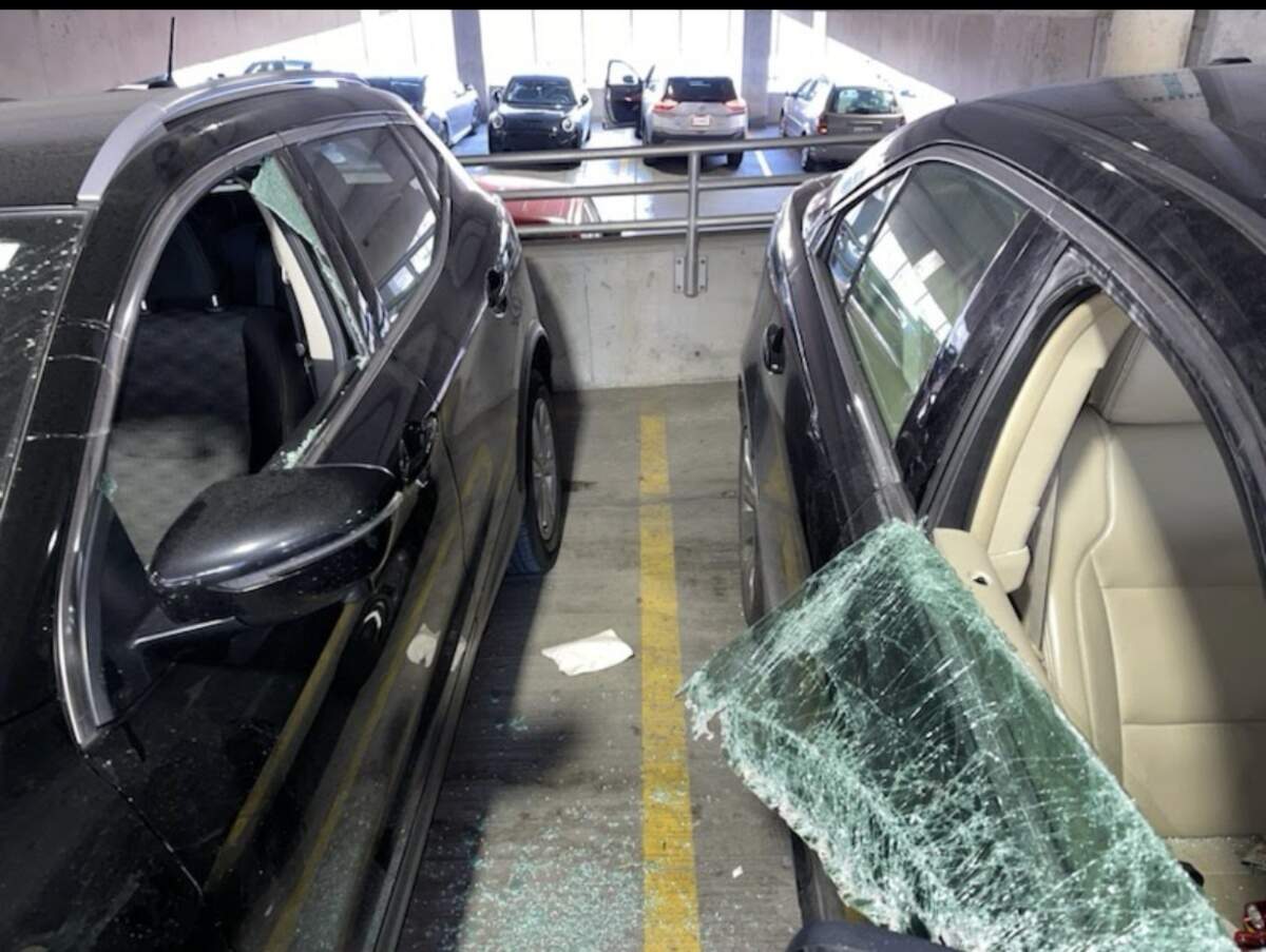 Picture of cars broken into in a parking garage located at 1120 Oak St near City Hall. Provided by victim