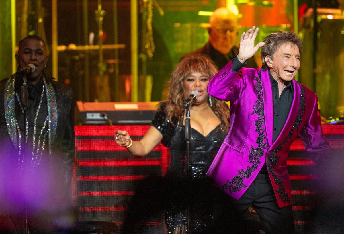 Barry Manilow performs on stage at the T-Mobile Center during a stop Sunday in Kansas City as part of The Last Concerts Tour.