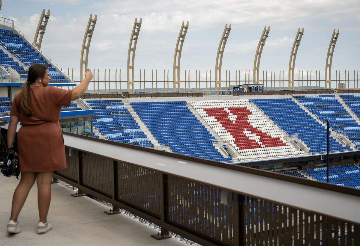 Red and white seats create a large ‘K’ in the north end of the renovated at David Booth Kansas Memorial Stadium on Tuesday, Aug. 19, 2025, at the University of Kansas in Lawrence.