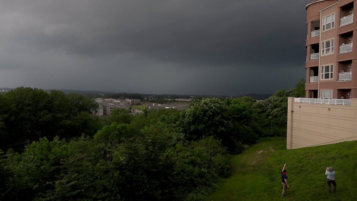 Storm-chasing tour vans hit by rain-wrapped satellite tornado of Lawrence supercell