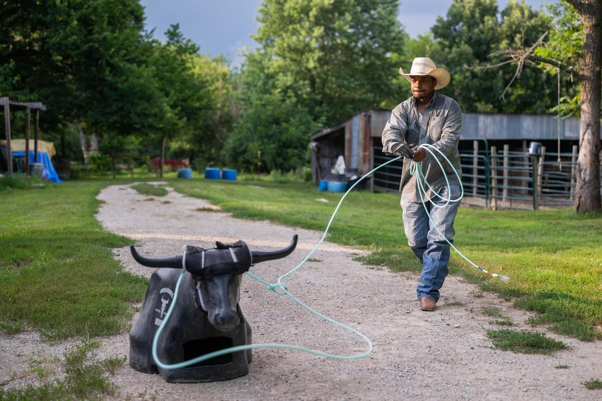 Daniel Bey practices roping a dummy steer with a lasso at his uncle’s ranch in Kansas City, Kansas, on Wednesday, July 16, 2025. Bey will be participating in the roping competition at the Black Rodeo USA stop in Kansas City on July 26th at the American Royal Center.