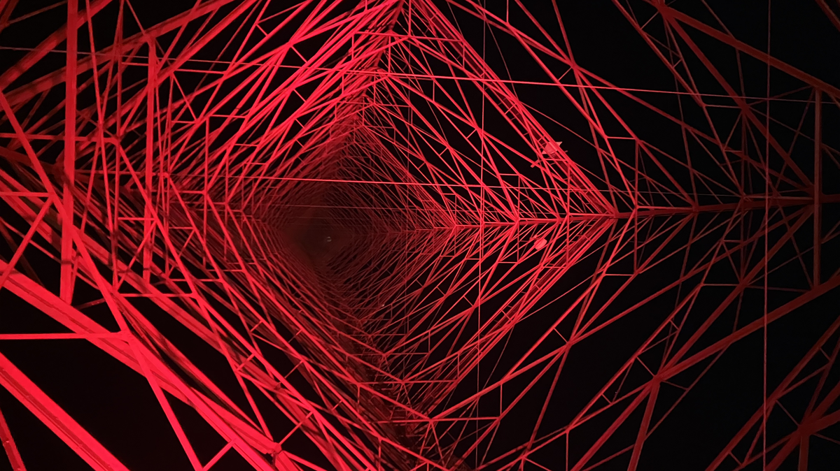 A look directly upward from underneath the massive KCTV-5 tower, which was illuminated red on Dec. 5.