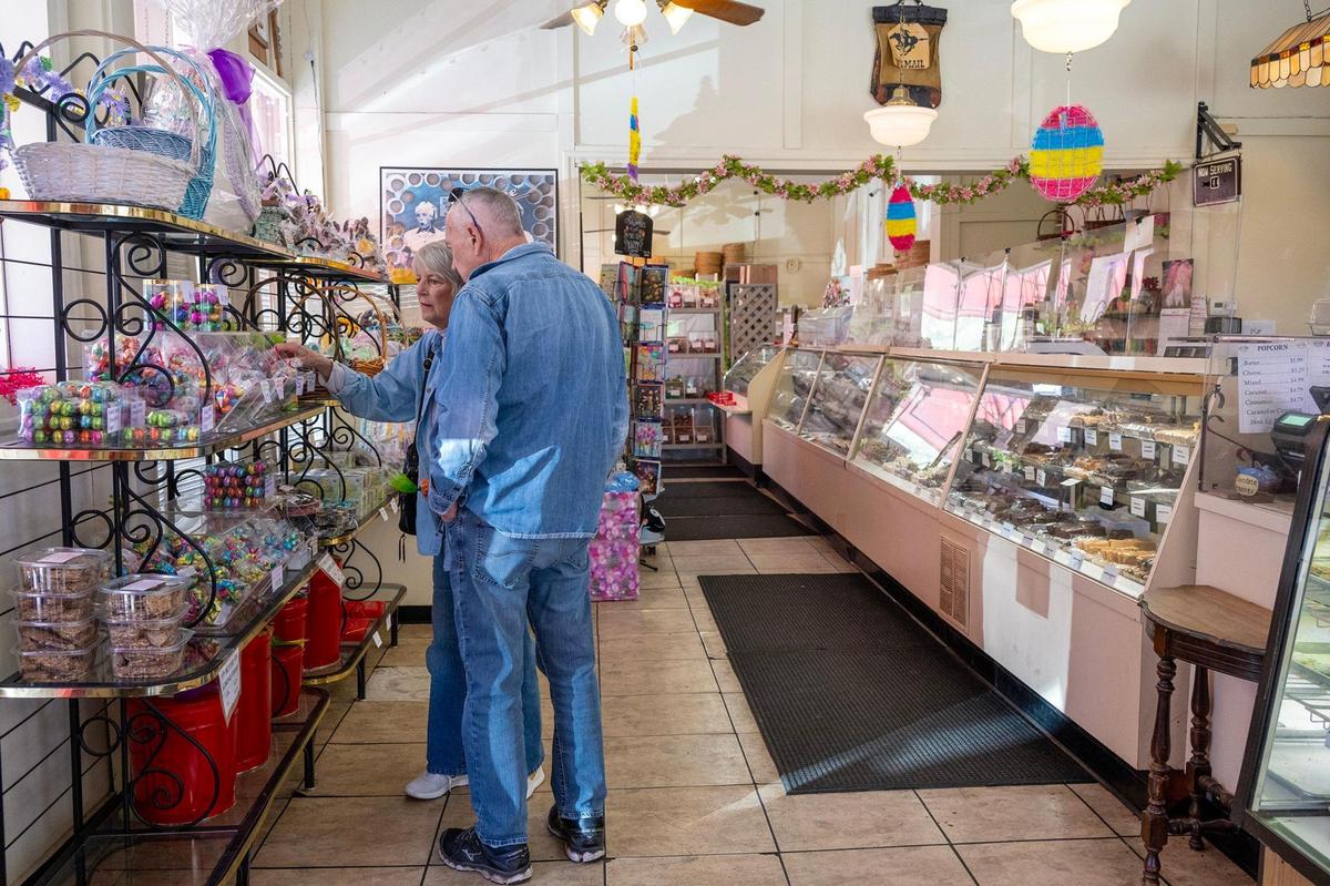 A couple browses the sweet Easter treats available at Laura Little’s Candies.