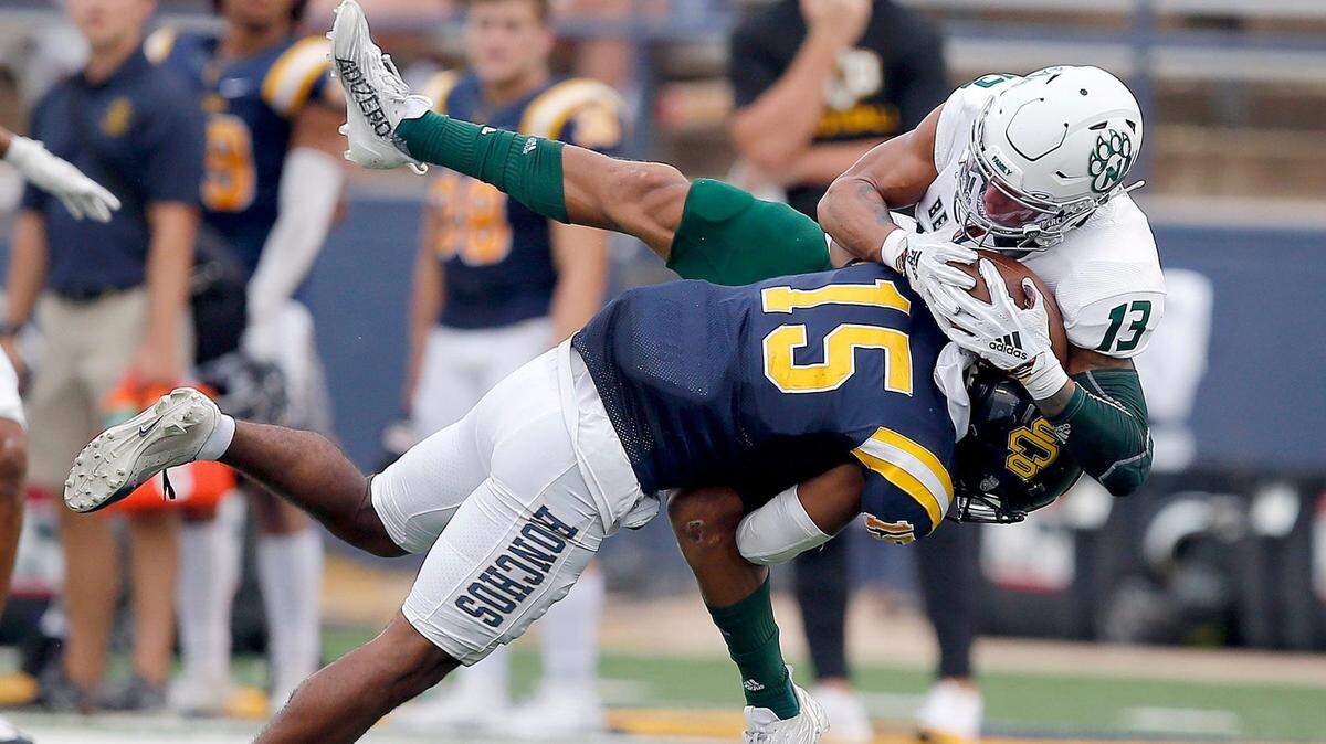 Central Oklahoma’s Rae’Quan Wicks tackles Northwest Missouri’s Trevon Alexander after he made a reception during a 2022 game.