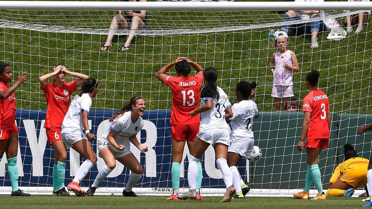 Houston’s Katie Naughton celebrates her goal in the middle of the Kansas City NWSL defense during the second period of Sunday’s match at Legends Field in Kansas City.